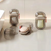 Modern soap holder containers with soap bars on a bathroom counter