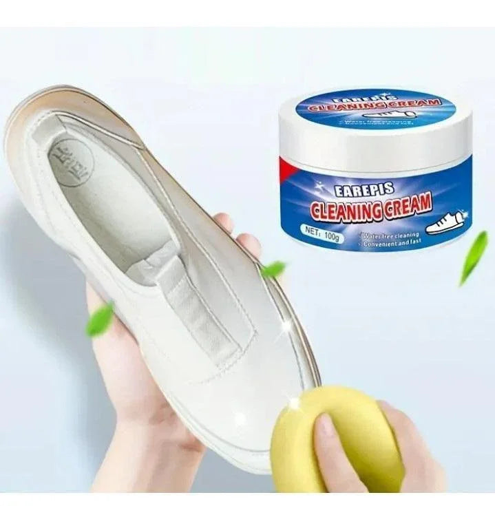 Hand cleaning white shoe with yellow sponge and EAREPIS cleaning cream container