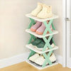 Corner shoe rack with four pairs of shoes in a modern room, space-saving storage organizer