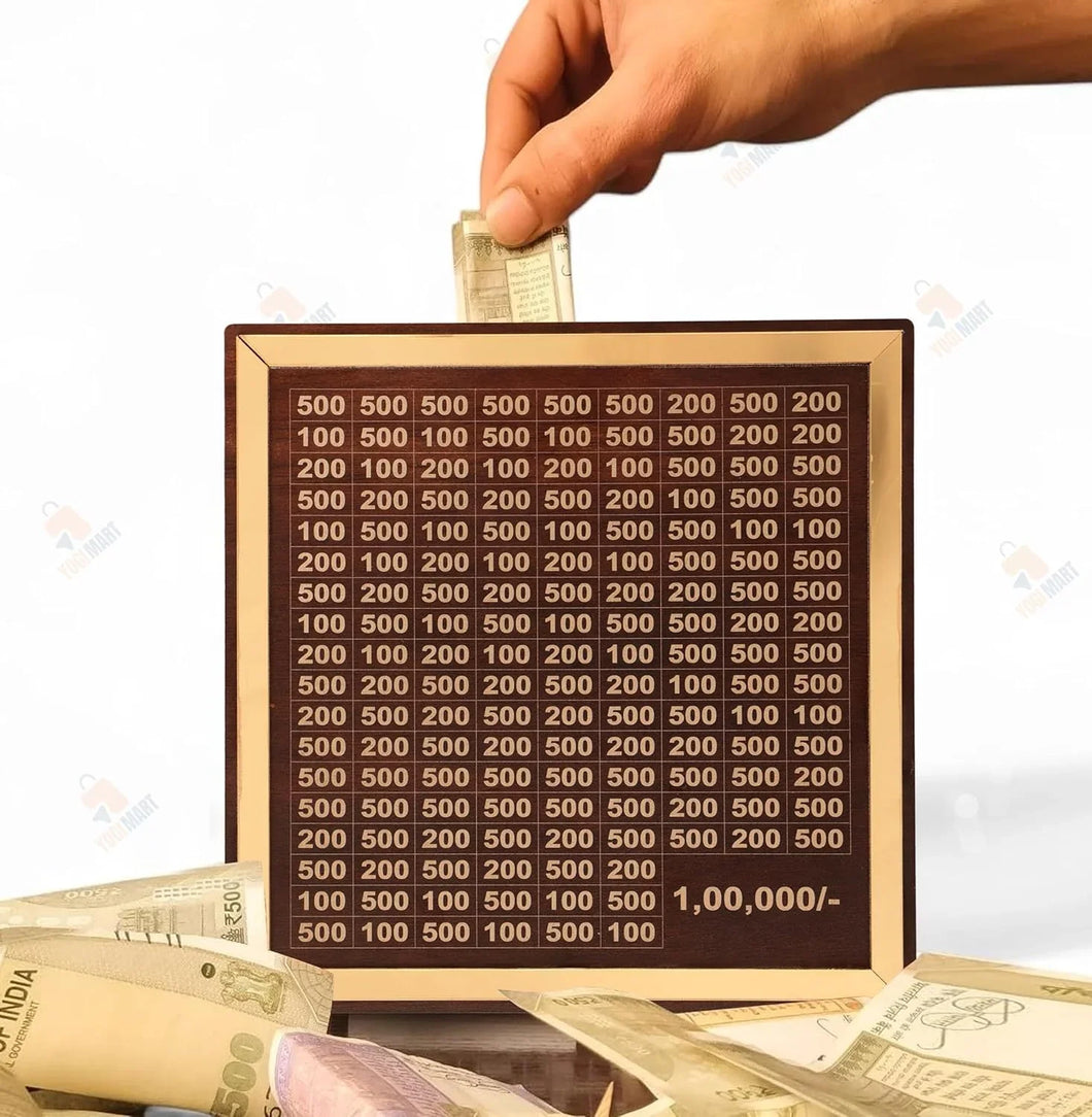 Hand inserting Indian currency note into wooden saving box with denominations grid, cash nearby.