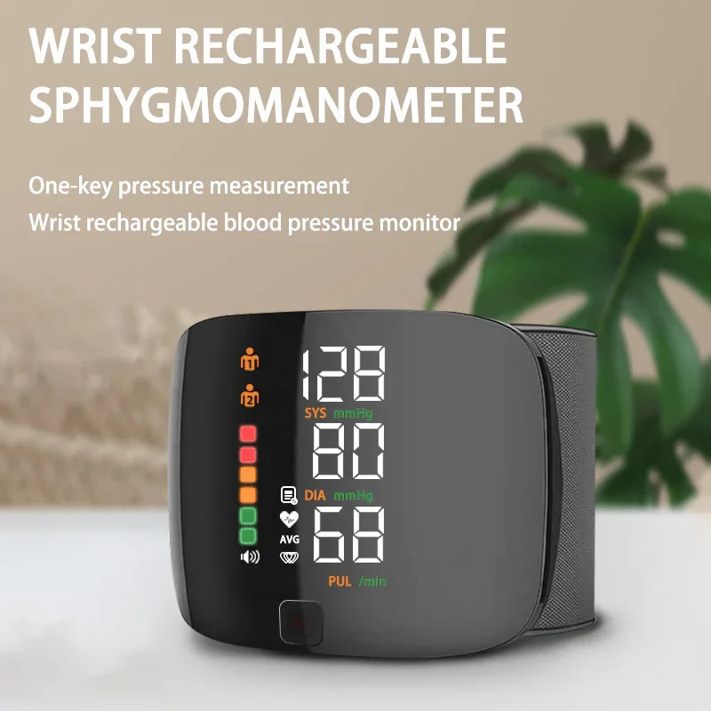 Wrist rechargeable sphygmomanometer digital blood pressure monitor on a table