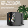Wrist rechargeable sphygmomanometer digital blood pressure monitor on a table
