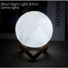 8.5cm white moon night light on wooden stand, glowing on a table, home decor lamp