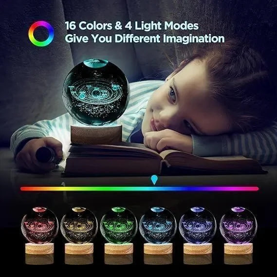 Girl reading with 3D galaxy crystal ball lamp, 16 color LED night light projector on desk