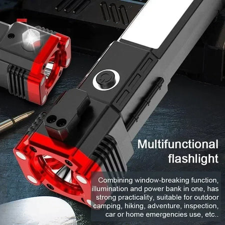 Multifunctional flashlight power bank charging smartphone on desk next to laptop.
