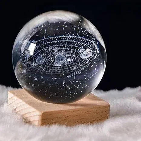 Crystal glass solar system model with engraved planet names on wooden base